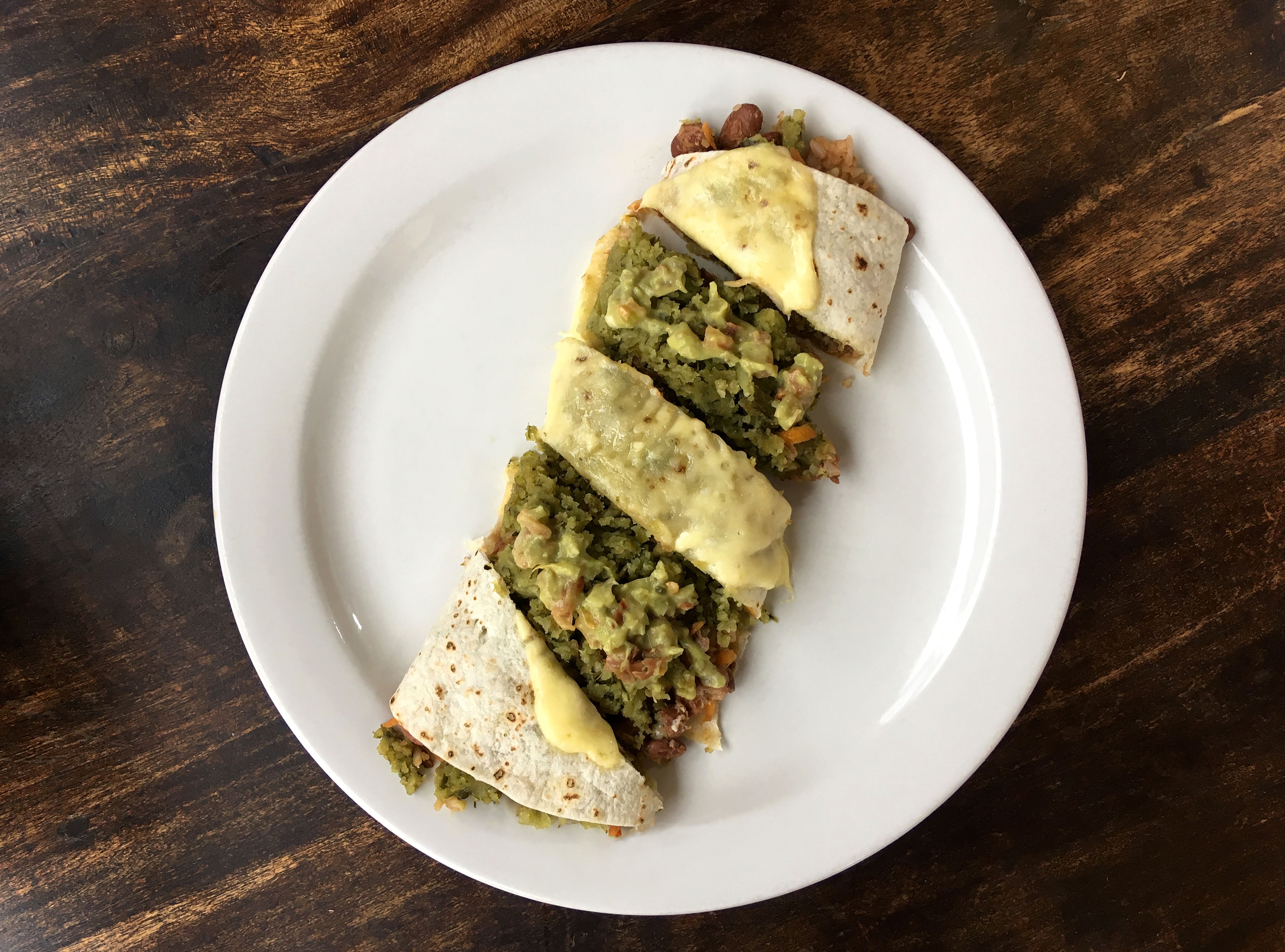 Free Tasty vegetarian quesadilla topped with cheese on a white plate, perfect for a healthy meal. Stock Photo