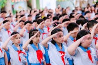 School Children Saluting in Uniform Assembly