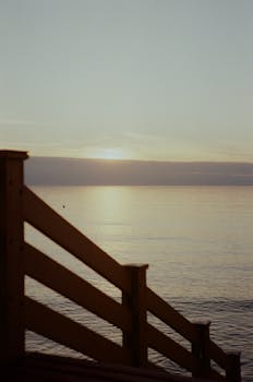 Tranquil sunset over the Baltic Sea with calming ocean waves.