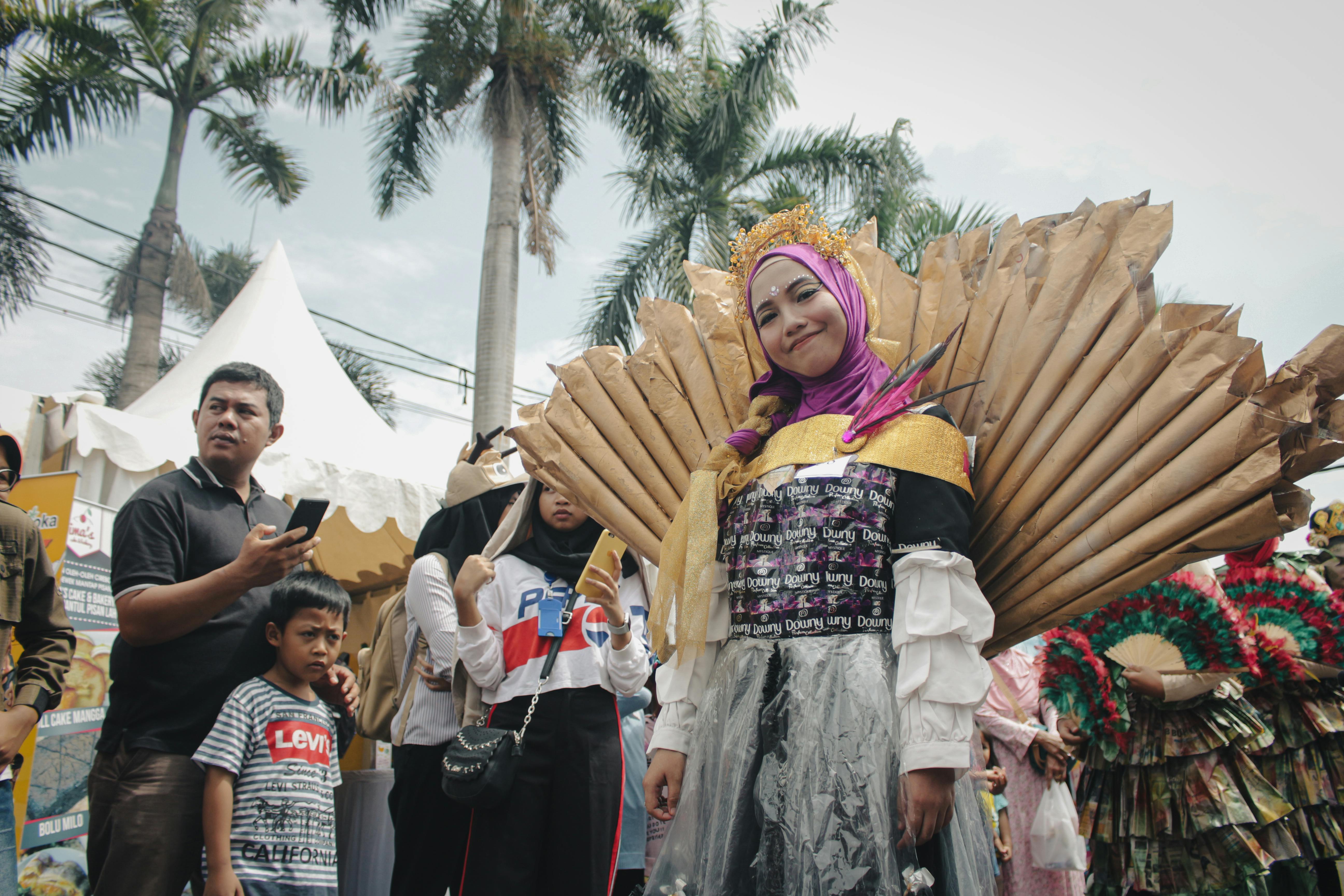 A vibrant cultural festival in West Java showcasing traditional Indonesian costumes and performances.