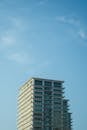 Modern High-Rise Under Clear Blue Sky