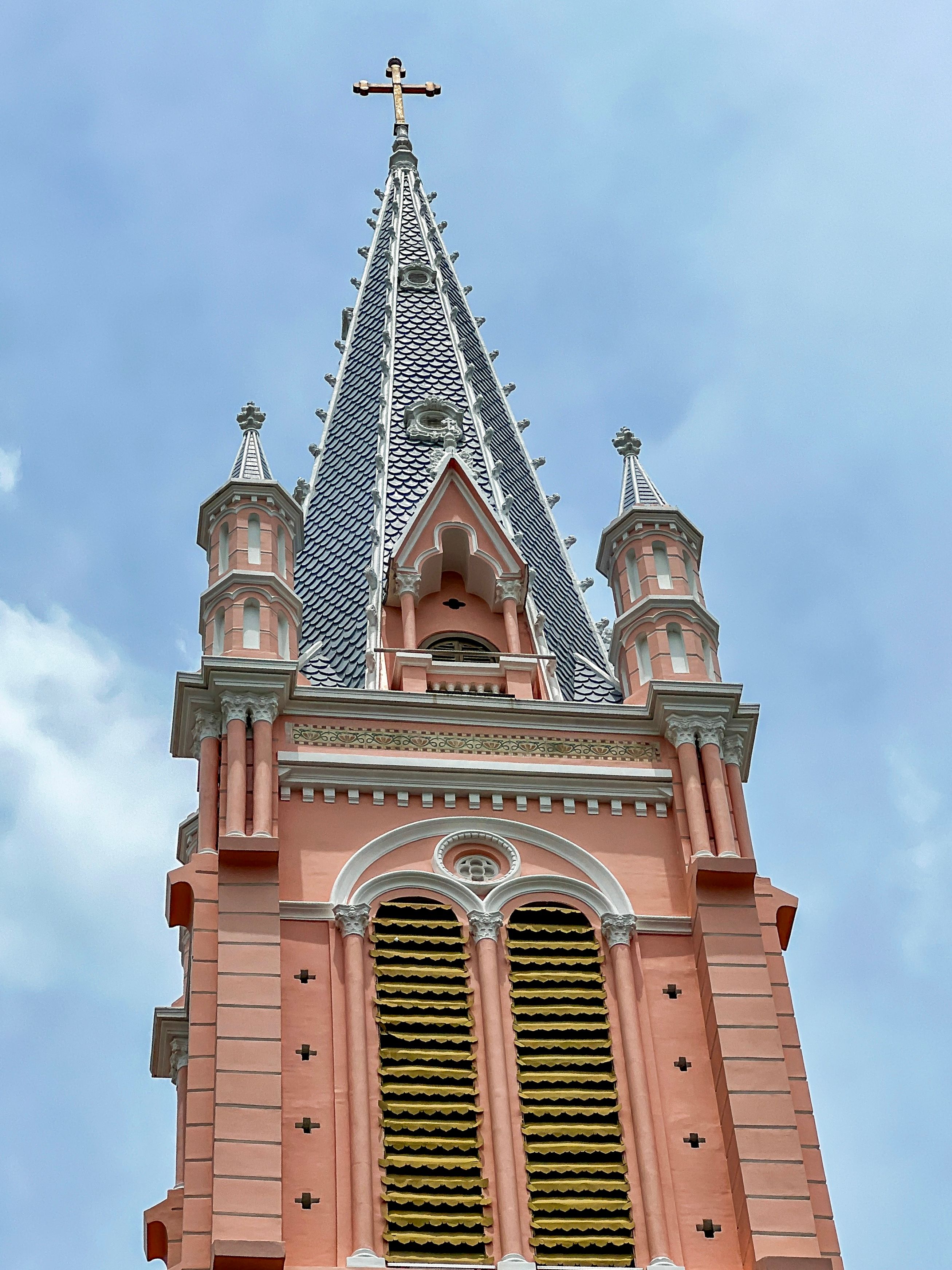 Pink Gothic Church Spire Against Blue Sky · Free Stock Photo