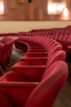 A row of red theater seats in an empty auditorium, Mar del Plata, Argentina.
