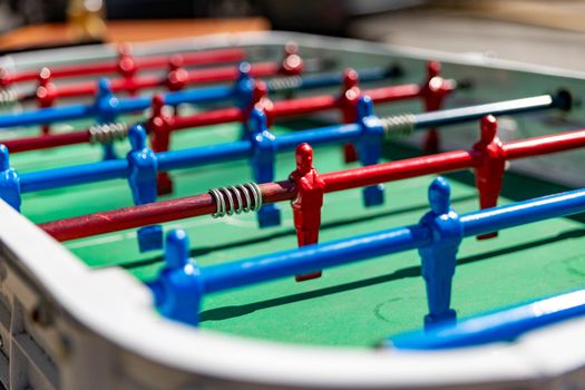 Colorful foosball table showcasing vibrant player rods in Buenos Aires sunlight.