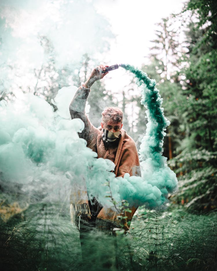 Man Holding Smoke Bomb