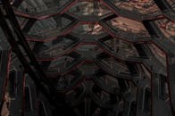 从鸟瞰视角看，这座未来主义建筑展现了现代创新，其几何楼梯和钢结构设计清晰可见