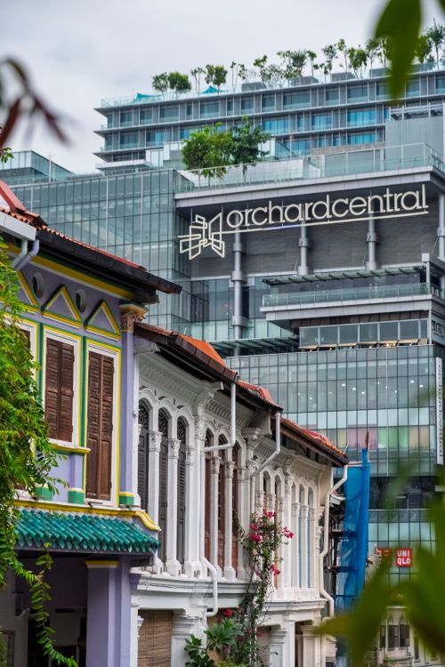 Free Orchard Central and colorful shophouses juxtapose modern and historical architecture in Singapore. Stock Photo