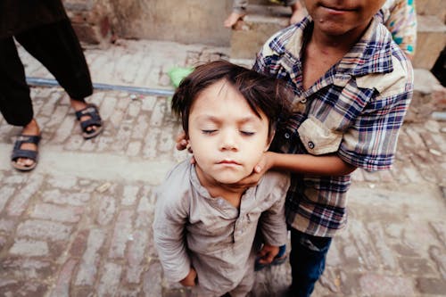 Photo Of Kid With His Eye Closed