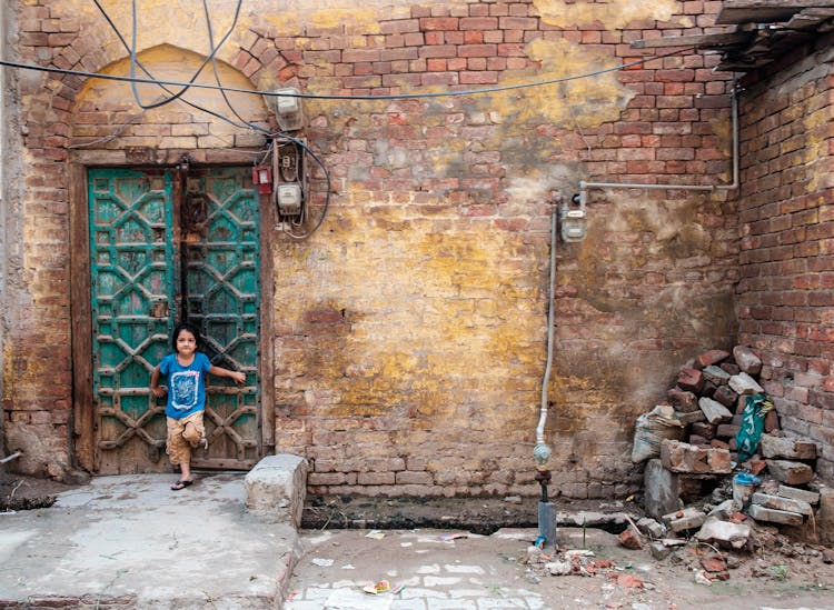 Photo Of Kid Leaning On Door