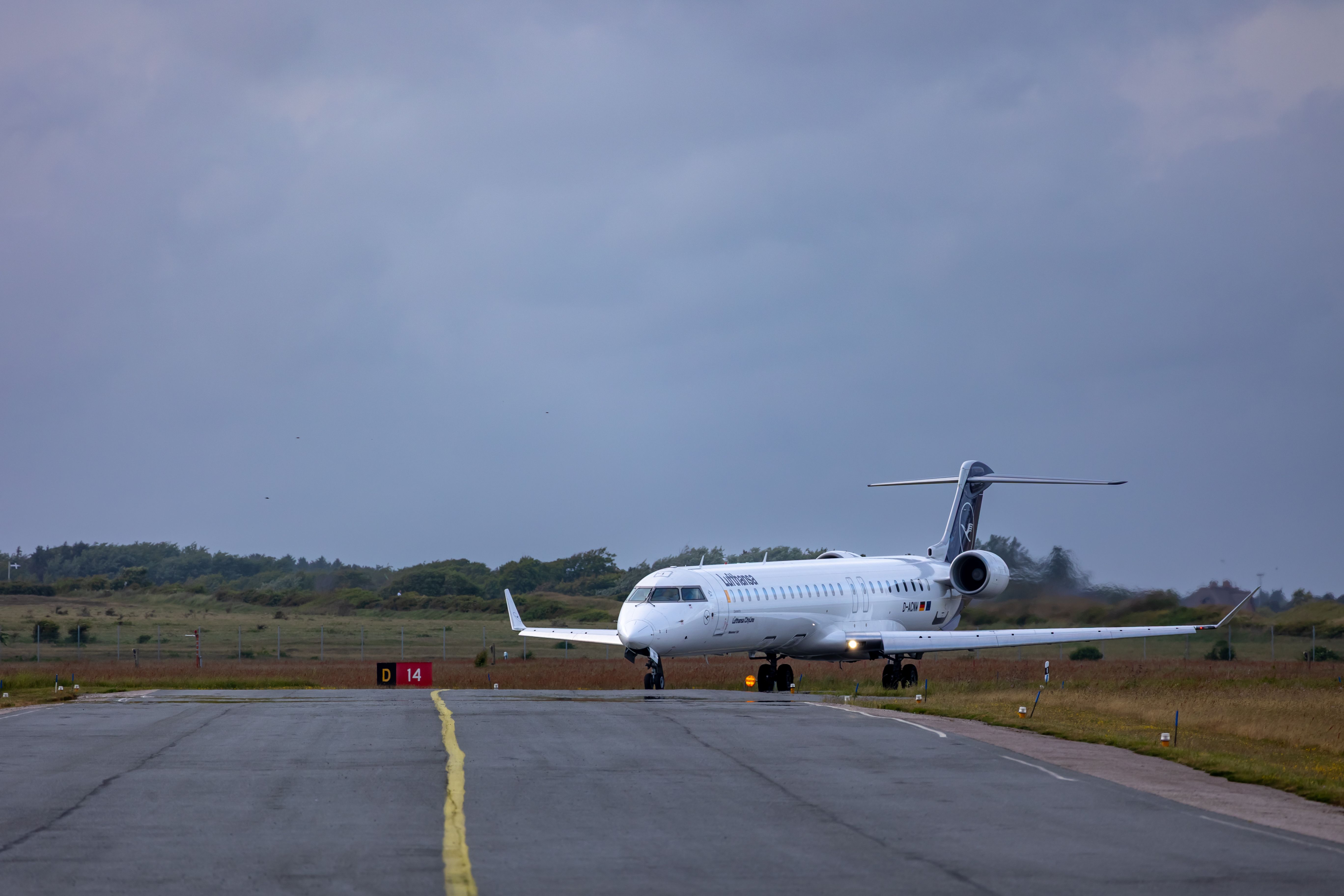 Passenger Plane on Runway at Dusk