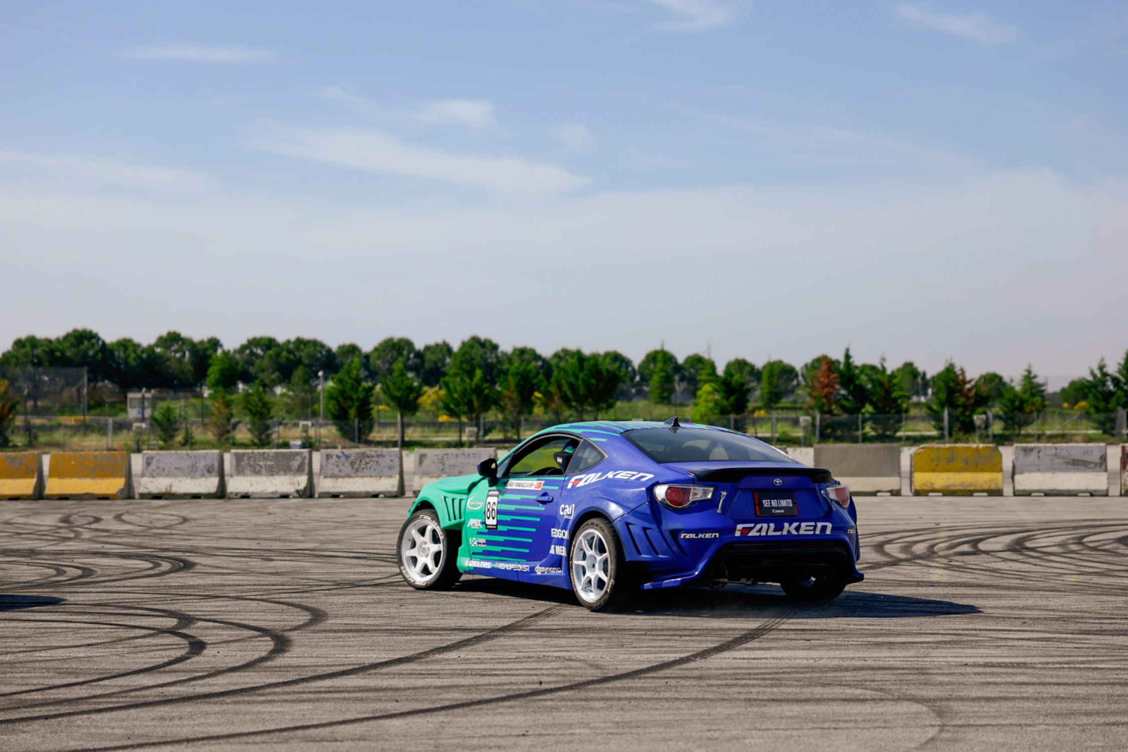 Blue Rageing Car Blue Racing Car Drifting on Open Track · Free Stock Photo