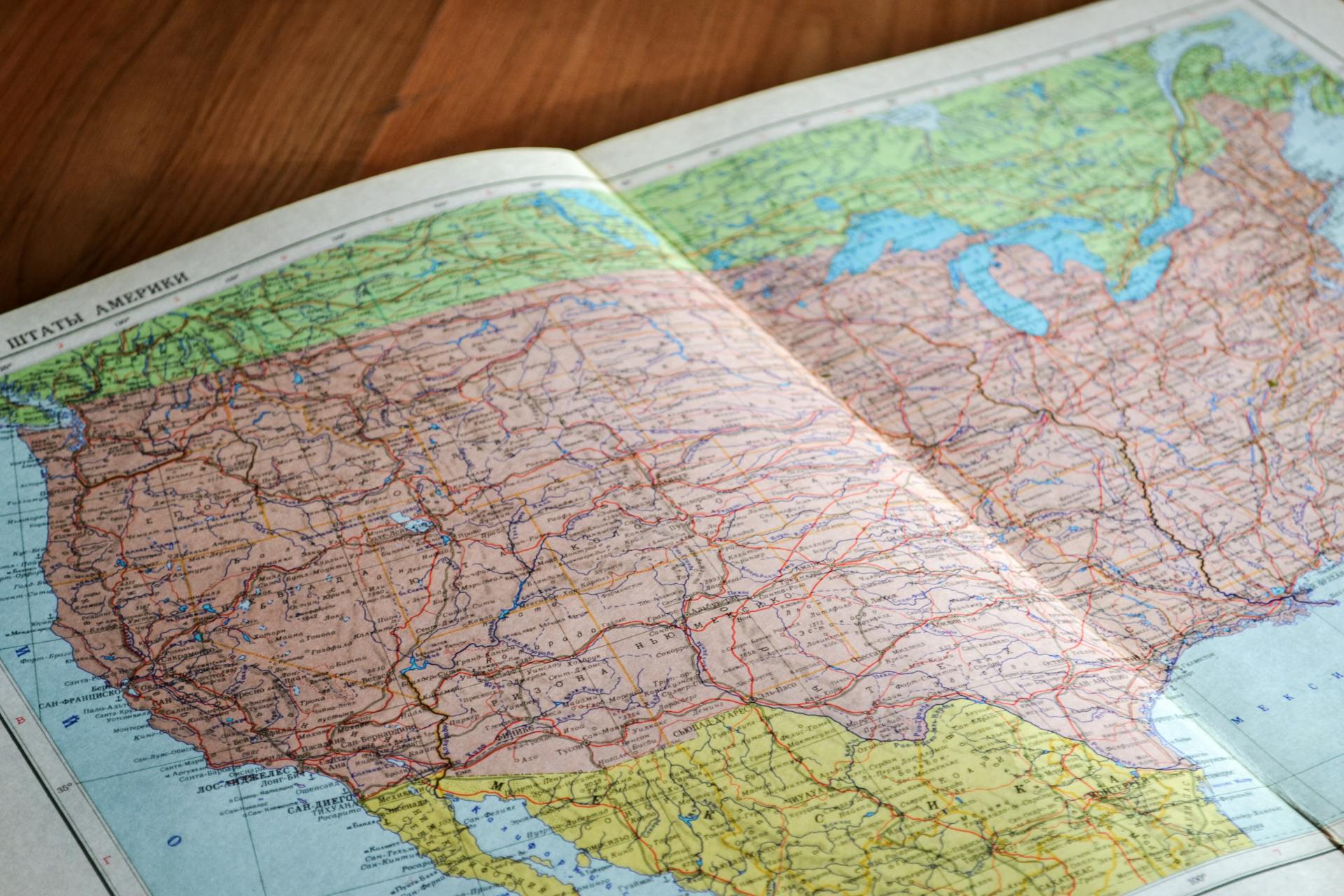 High-angle view of a vintage map depicting the United States with intricate details.