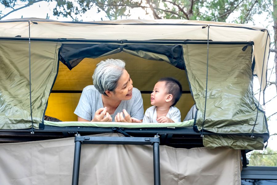 Illustrative low-profile rooftop tent camping scene