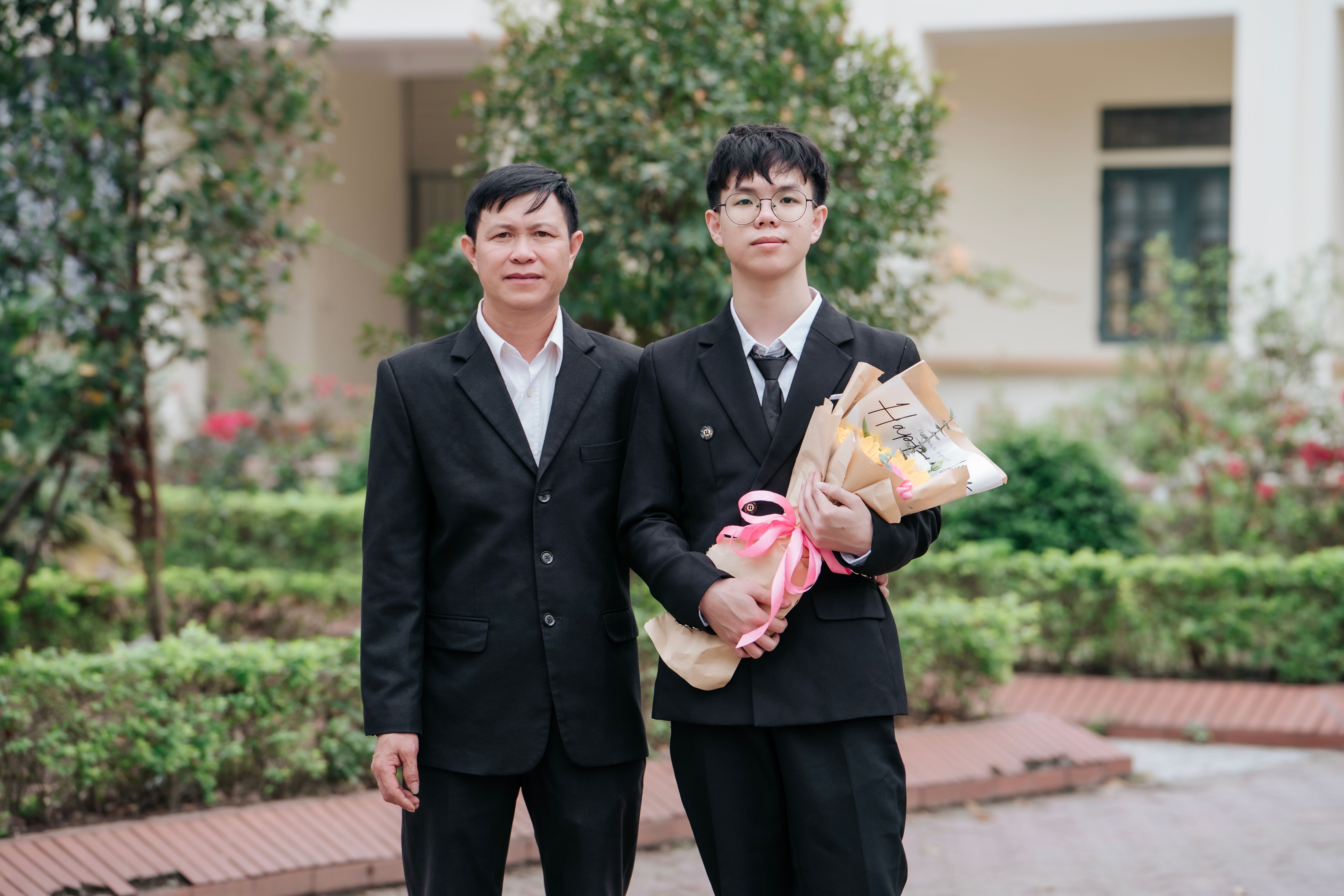 Father and Son Celebrating Graduation Outdoors · Free Stock Photo