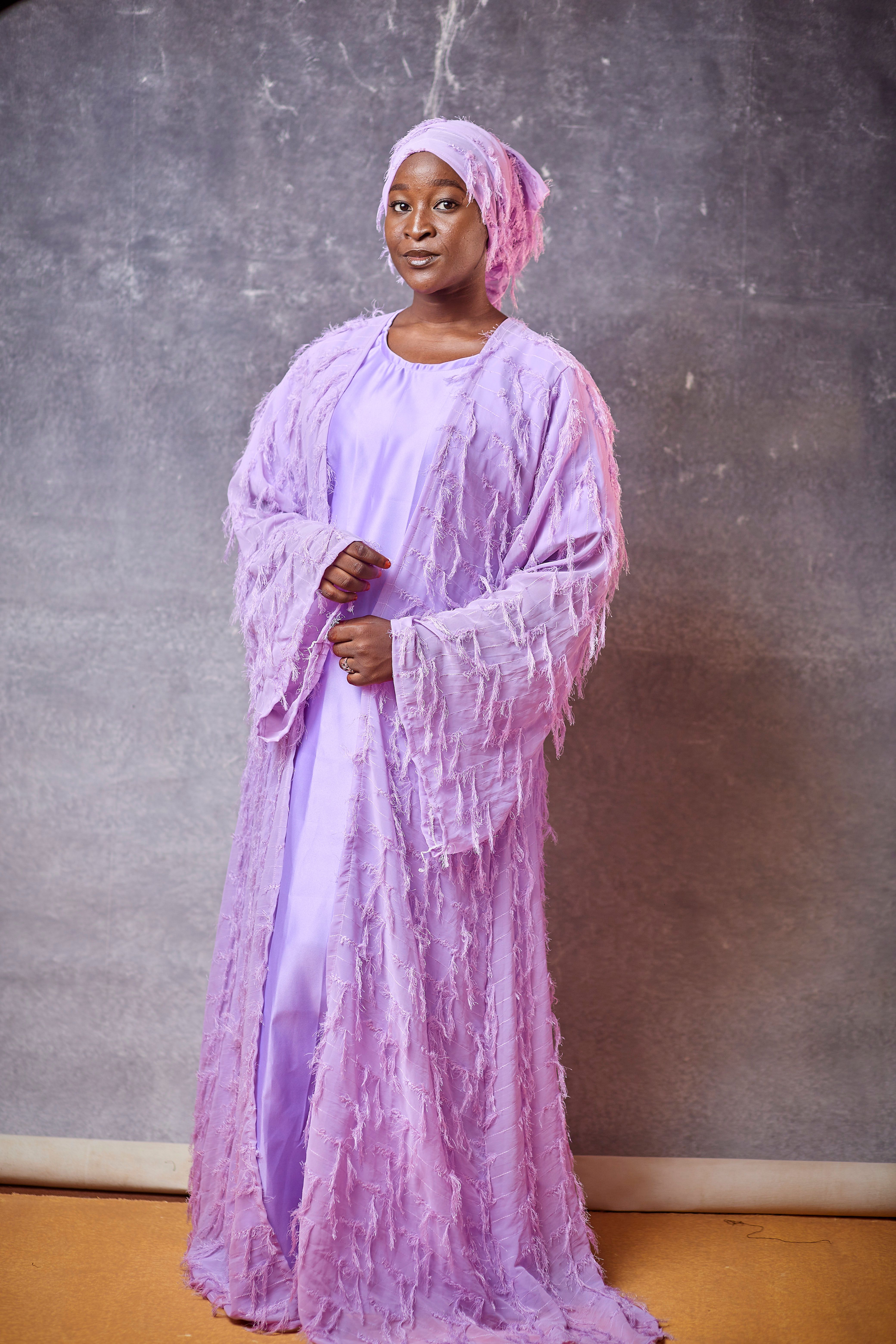 Elegant Portrait of Woman in Lavender Attire · Free Stock Photo