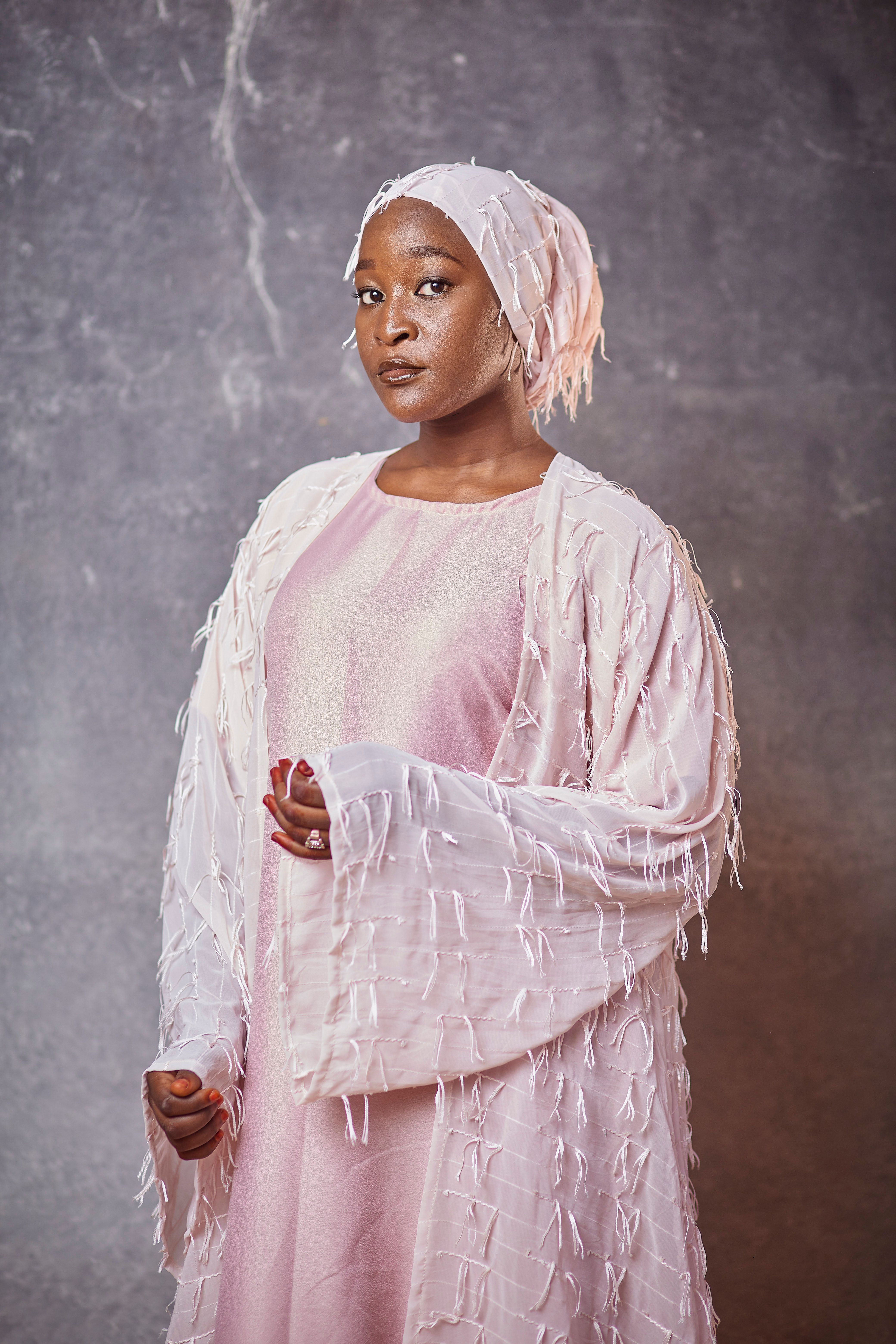 Elegant Portrait of Woman in Pink Attire · Free Stock Photo