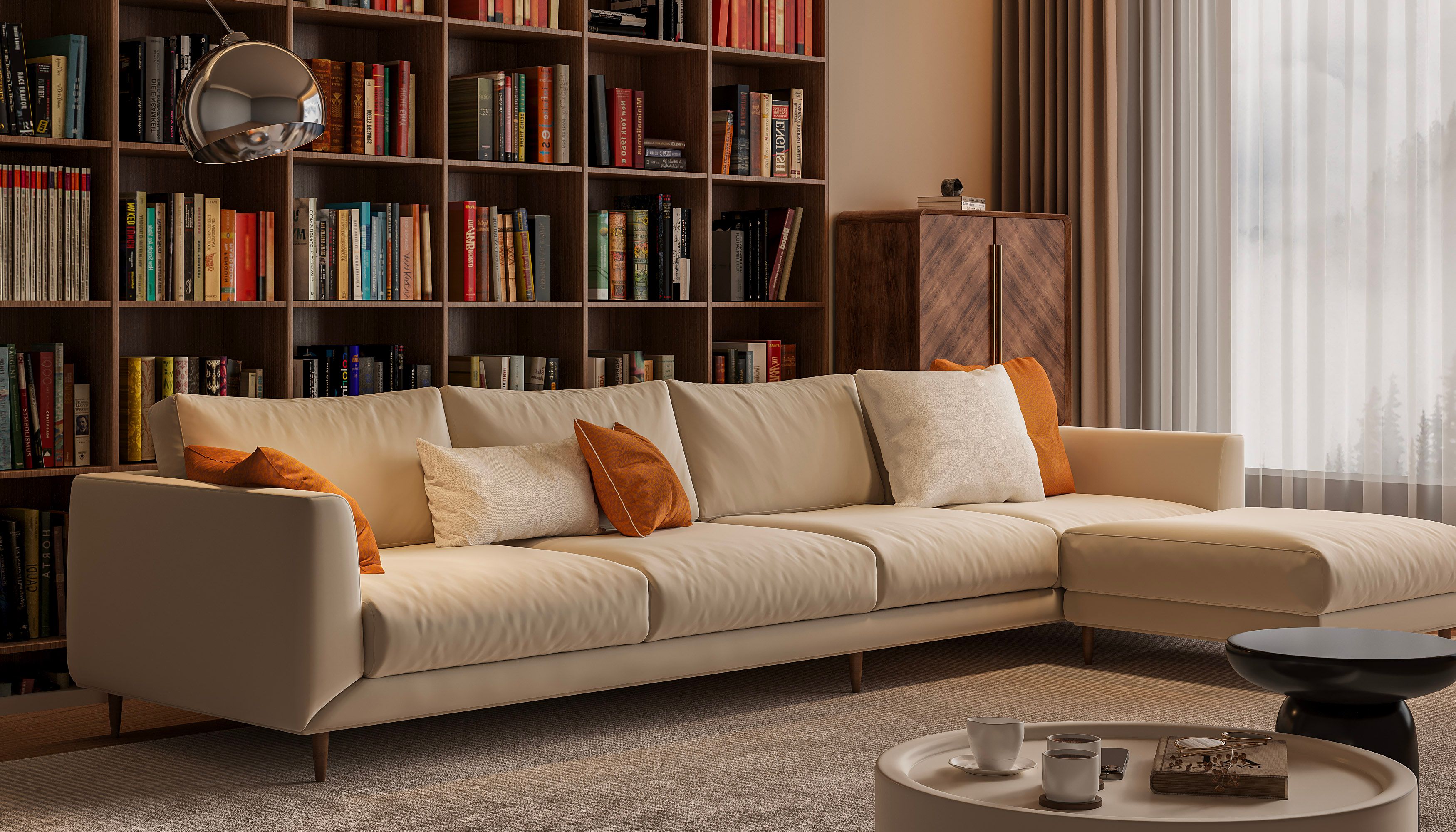Elegant living room with beige sofa, books, and warm lighting in a stylish Parisian apartment.
