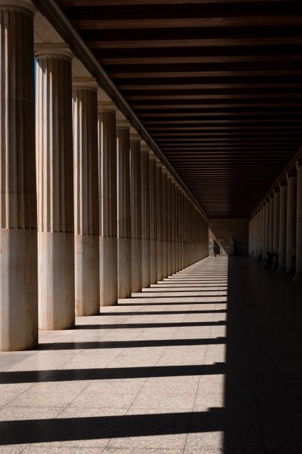 Explore the timeless elegance of the Stoa of Attalos with its classical columns casting rhythmic shadows.