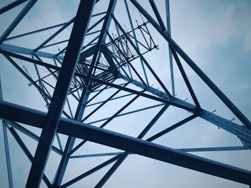 Free Low Angle View of Electricity Pylon Against Sky Stock Photo