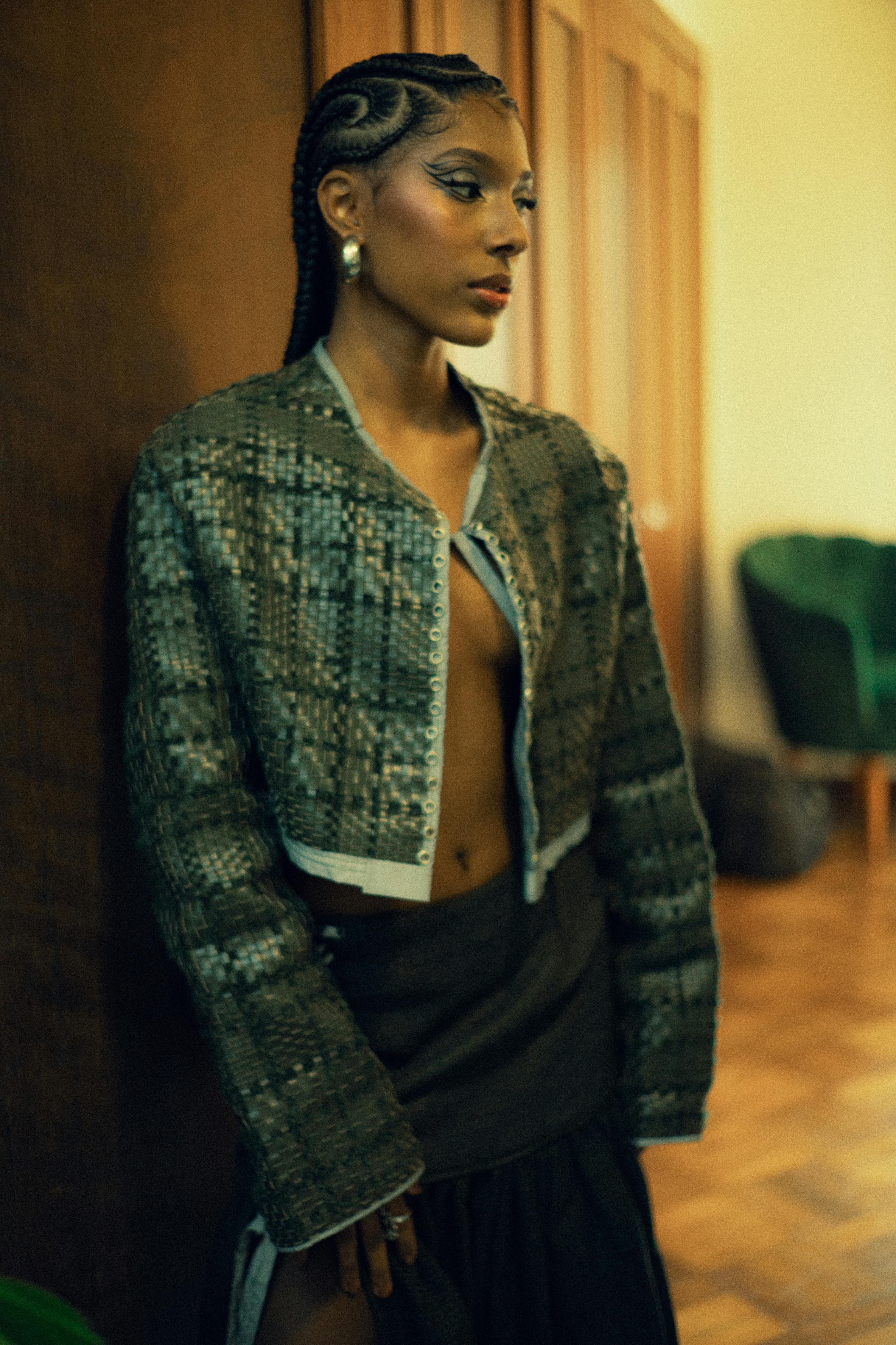 Fashionable portrait of a woman in stylish attire indoors in São Paulo.