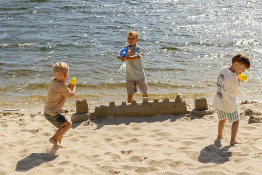 kids building sandcastle