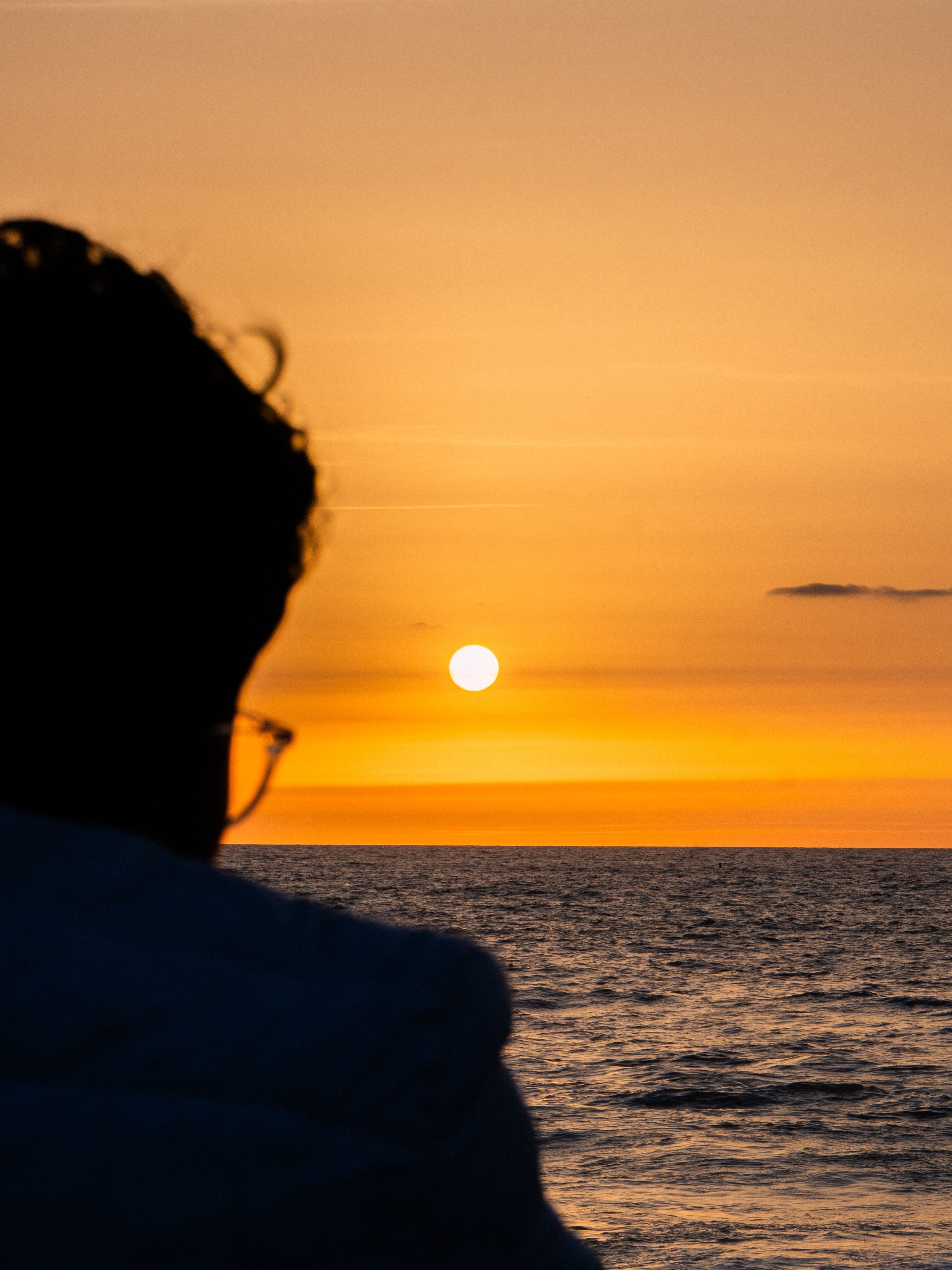 Silhouette Watching Sunset Over Atlantic Ocean · Free Stock Photo