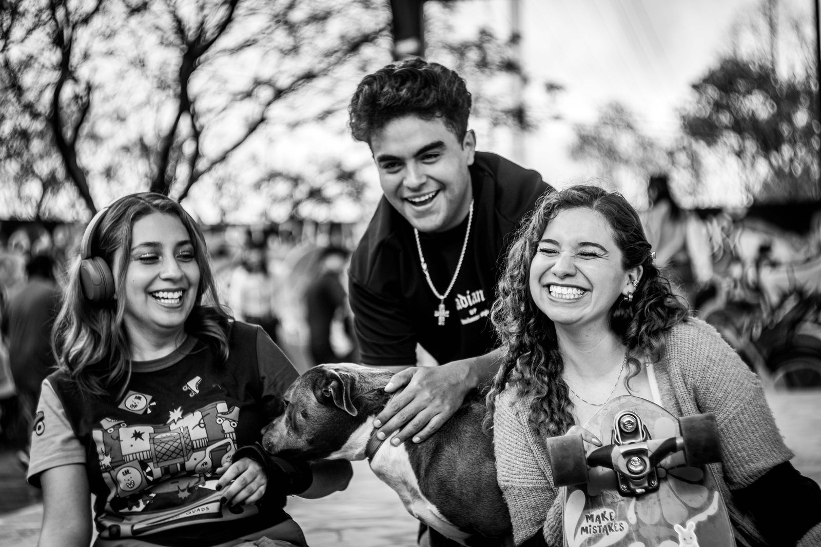 Friends gathered together outdoors in candid black and white