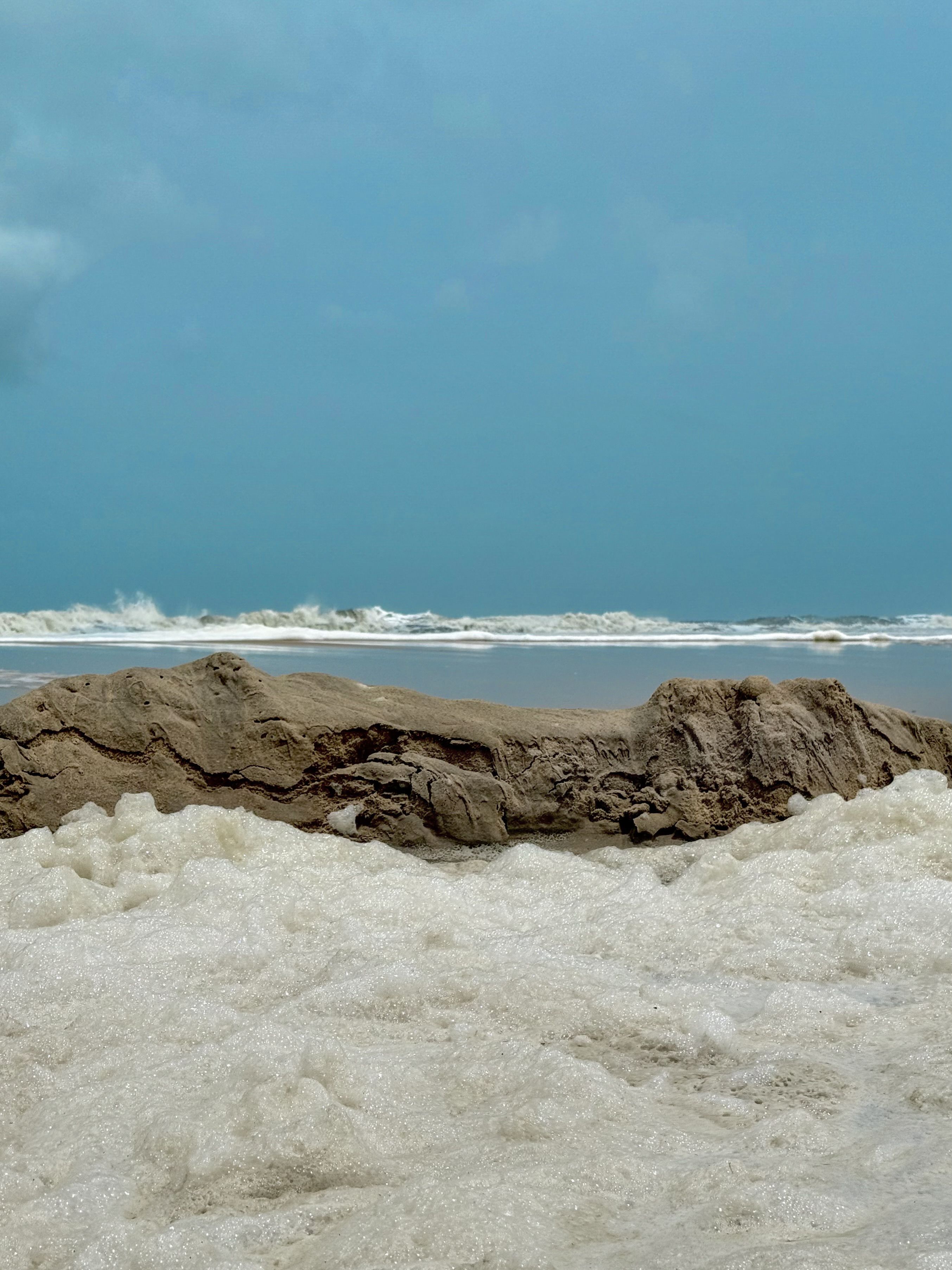 Scenic Beach with Rock Formation and Waves · Free Stock Photo