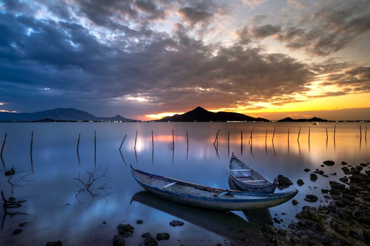 Two White Wooden Boats