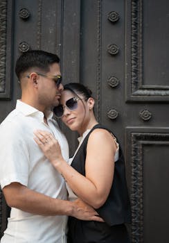 A couple shares a romantic embrace outdoors in Buenos Aires, Argentina.