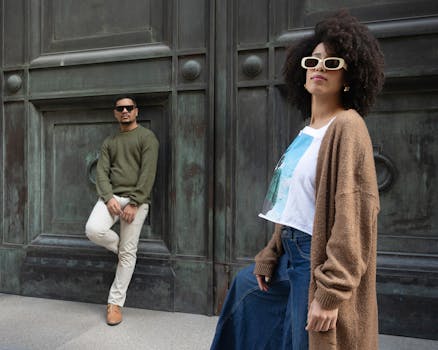 Fashionable pair striking a pose against an urban backdrop in Buenos Aires.
