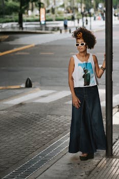 Stylish woman poses on a Buenos Aires street, showcasing modern urban fashion.