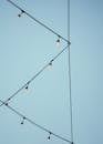 Outdoor String Lights Against Clear Blue Sky