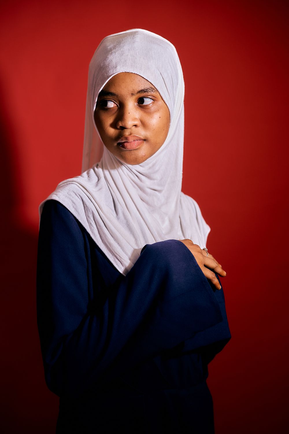 Portrait of Woman in Hijab Against Red Background · Free Stock Photo