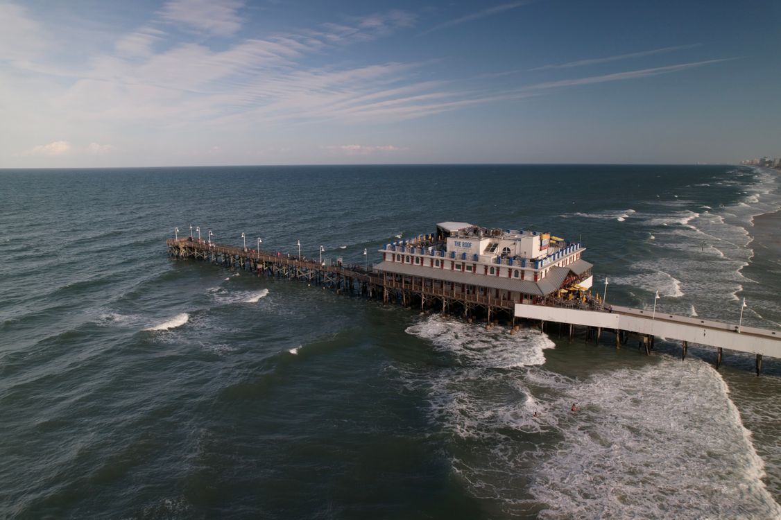 View Off Pier Scenic Aerial View of a Beachside Pier · Free Stock Photo
