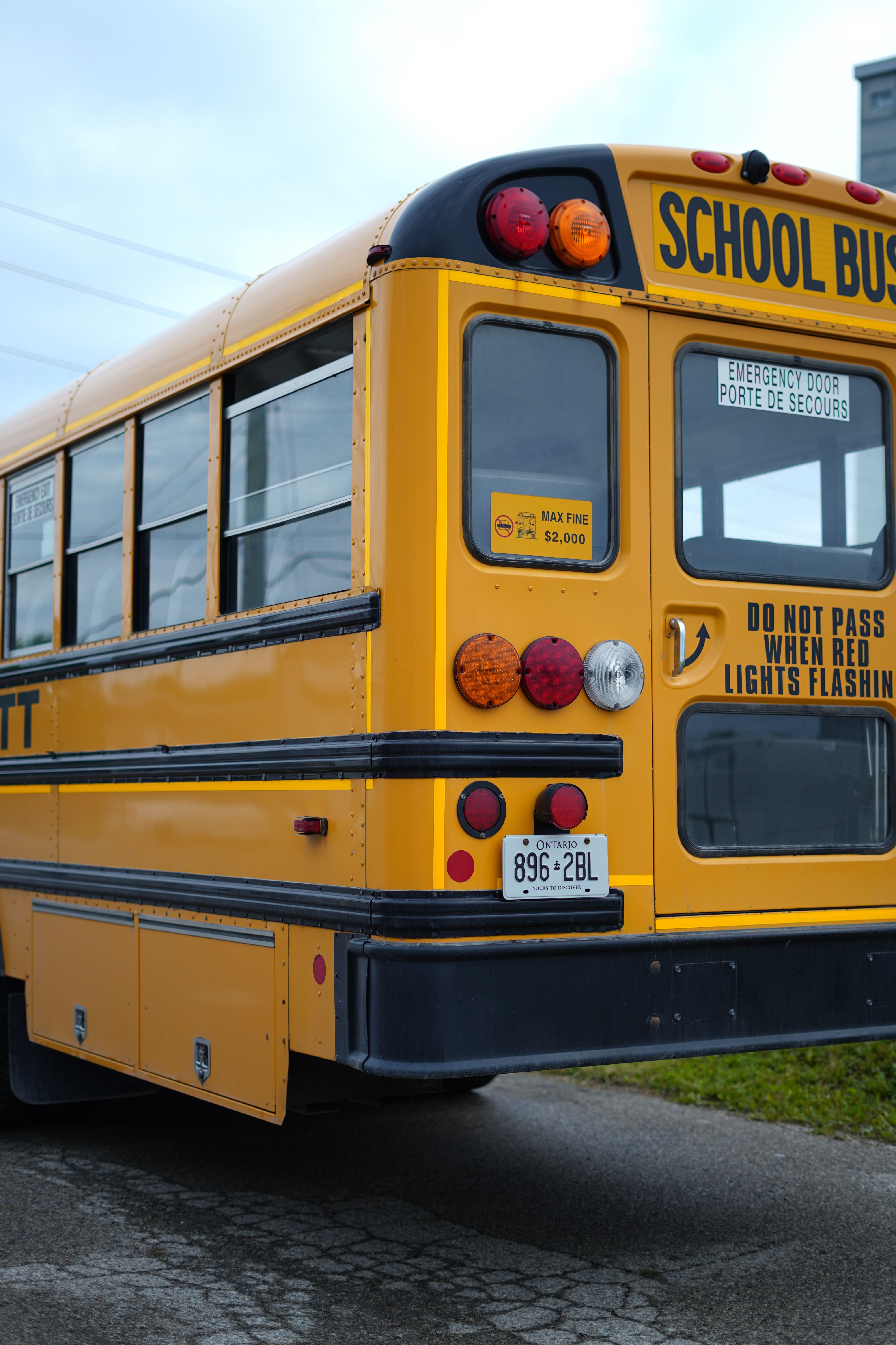 School principal reviewing school bus safety GPS tracking benefits