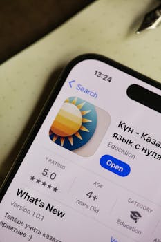 Close-up of smartphone with an educational app on display, showcasing user interface.