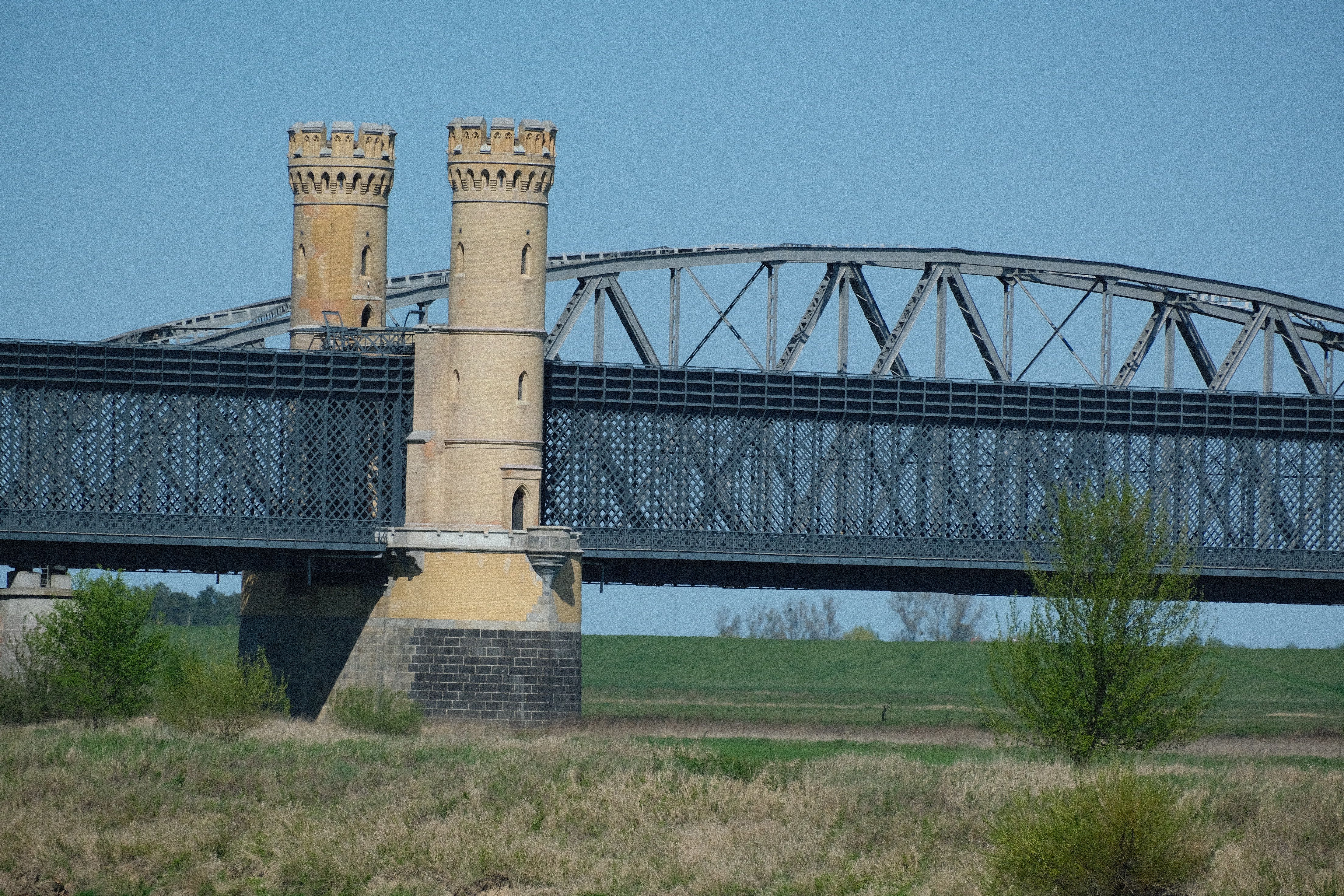 Historic Iron Bridge with Stone Towers Landscape · Free Stock Photo