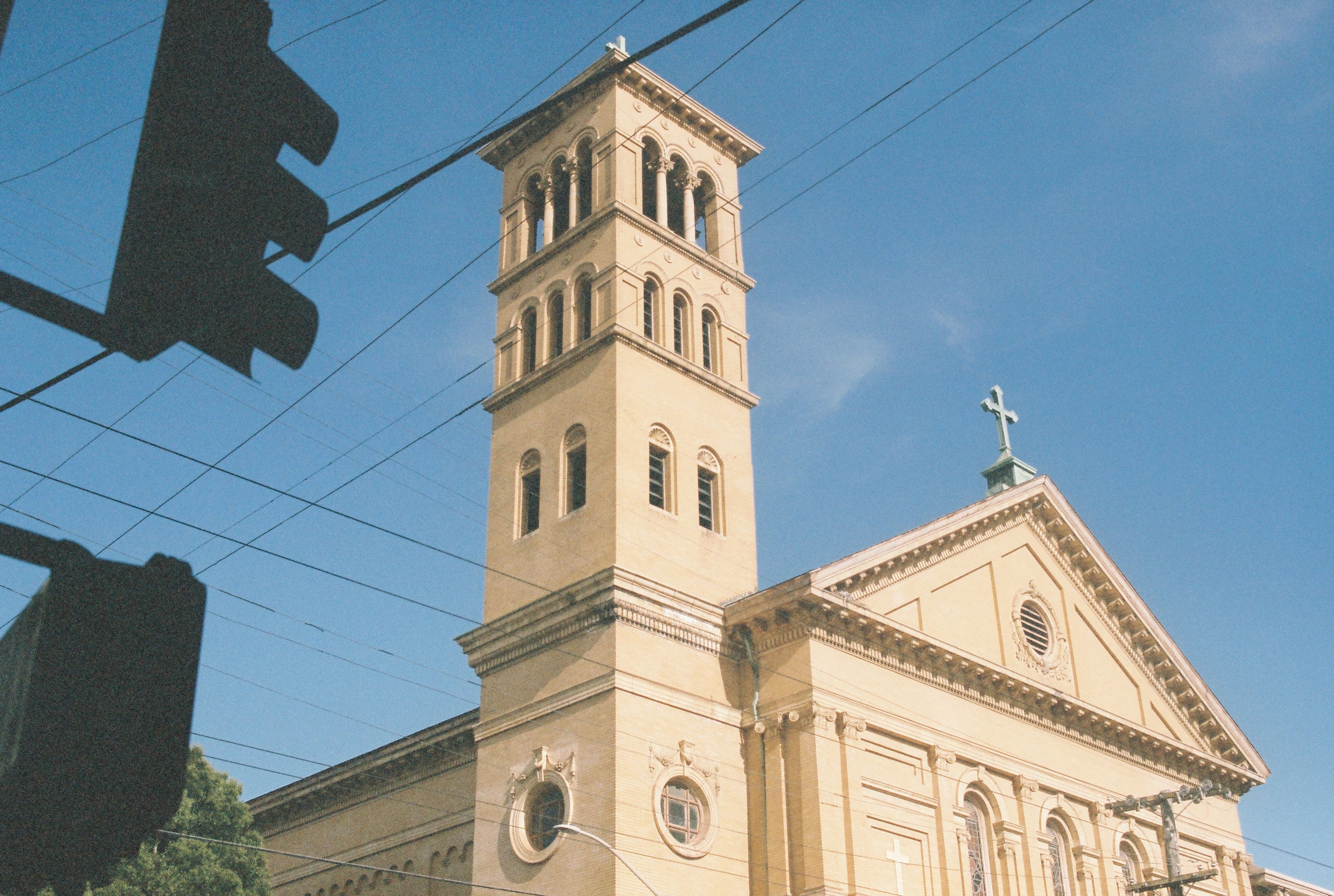 Historic Church Tower Against Clear Blue Sky · Free Stock Photo