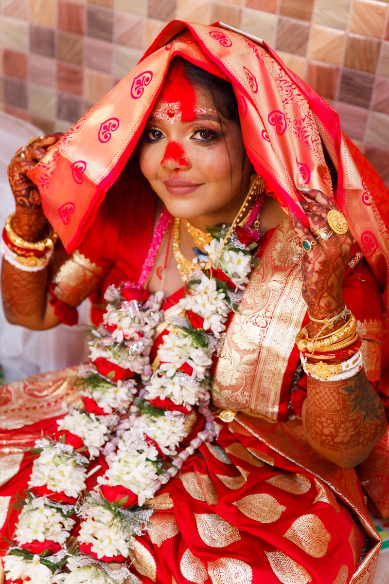 Bengali bride in red Benarasi saree from Bastra Museum Chinsurah