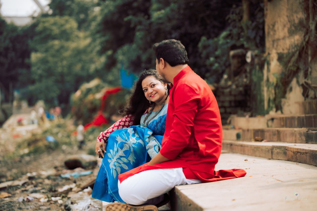 a joyful indian couple in traditional attire enjoying a romantic momen
