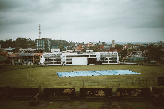 Aerial view of Galle International Stadium overlooking the city skyline in Sri Lanka.