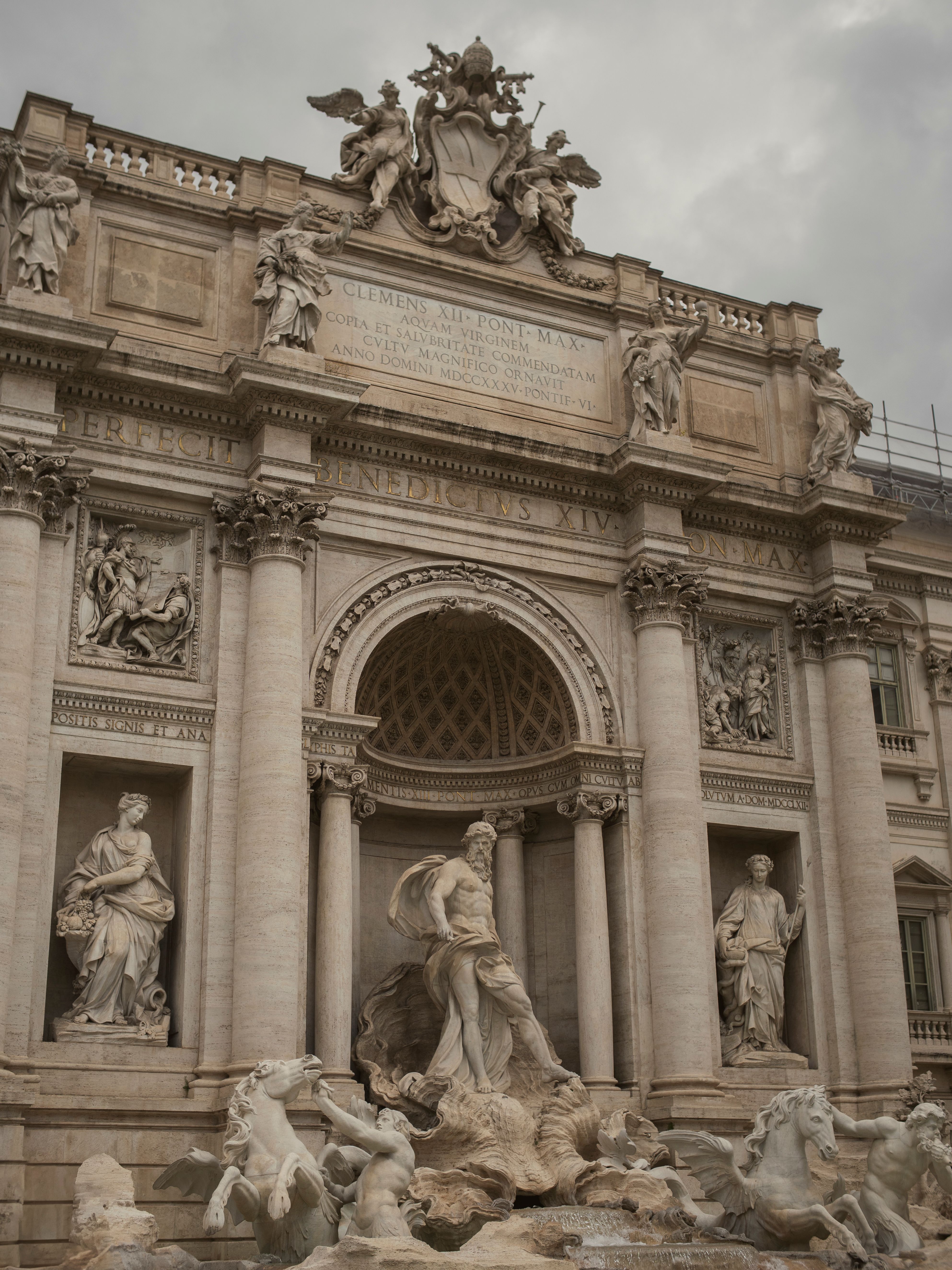 Stunning architectural details of the Trevi Fountain in Rome, featuring classical sculptures.