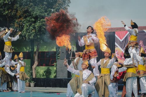 Free Traditional fire dance performance in West Java, Indonesia, showcasing cultural talent and dramatic flair. Stock Photo