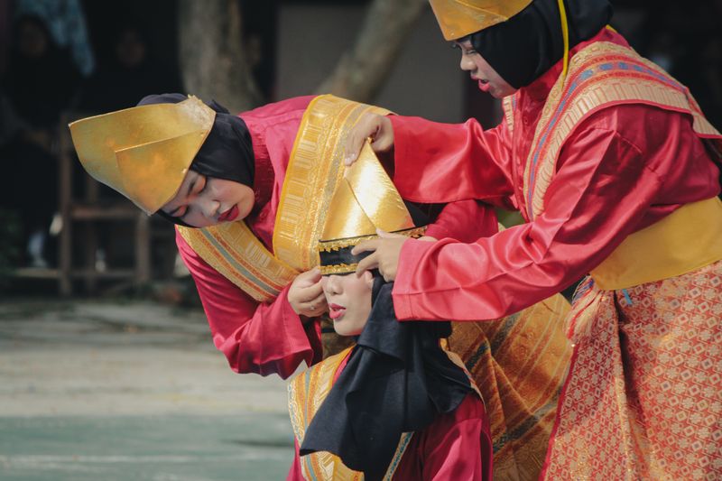 Teenagers in traditional attire perform a vibrant cultural dance