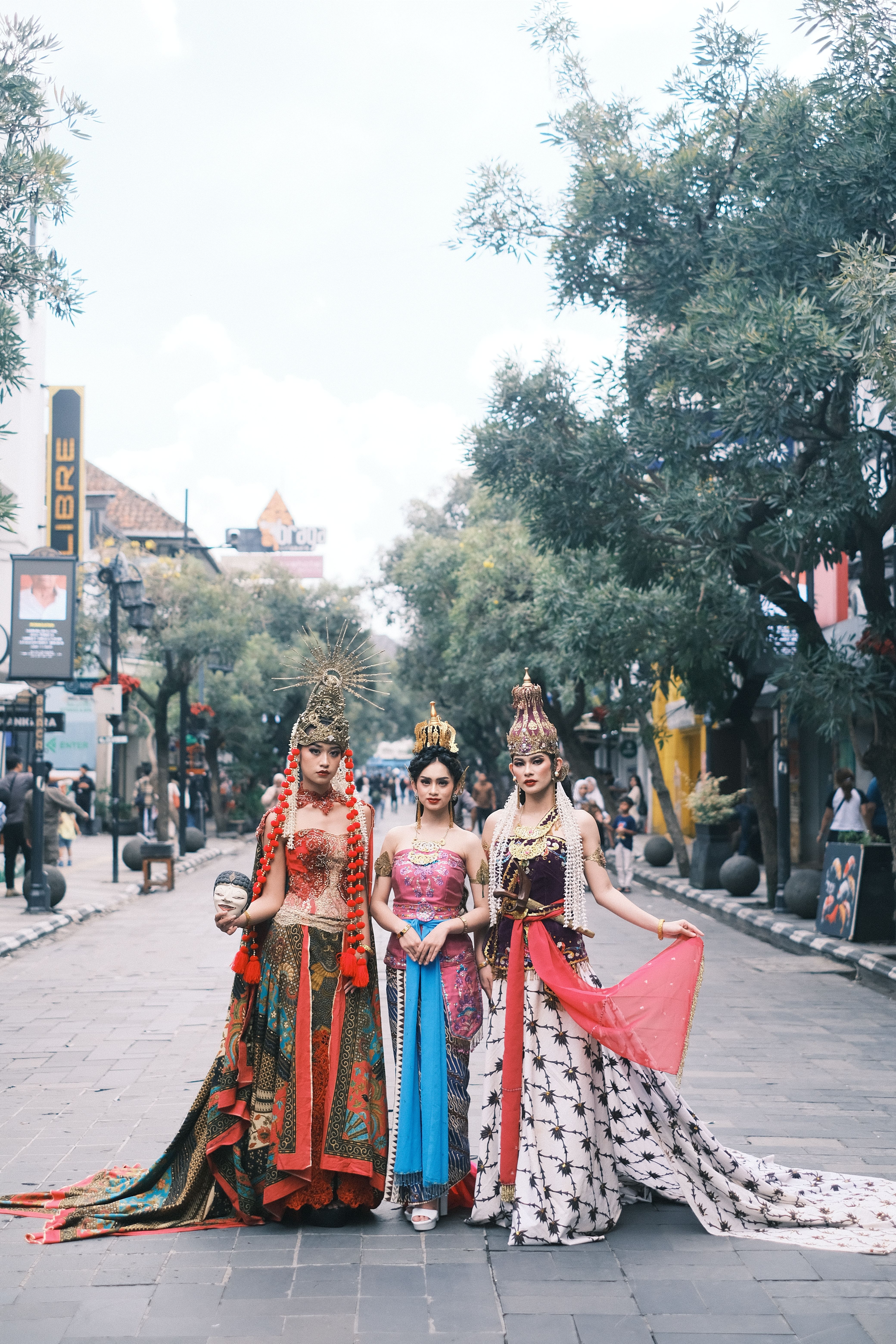 Traditional Indonesian costumes captured on Braga Street, a cultural highlight in Bandung.