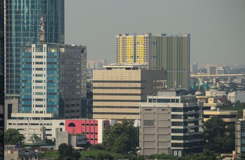 Free Cityscape featuring modern high-rise buildings under a clear sky. Ideal for urban development and architecture concepts. Stock Photo