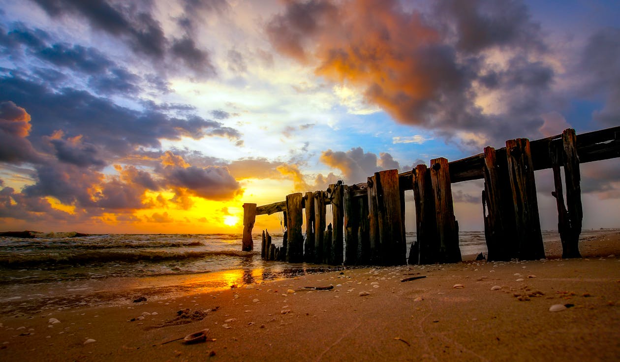Безкоштовне стокове фото на тему «берег, берег моря, Захід сонця»