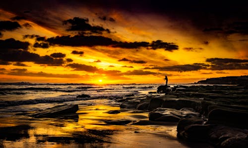 Man Fishing During Golden Hour