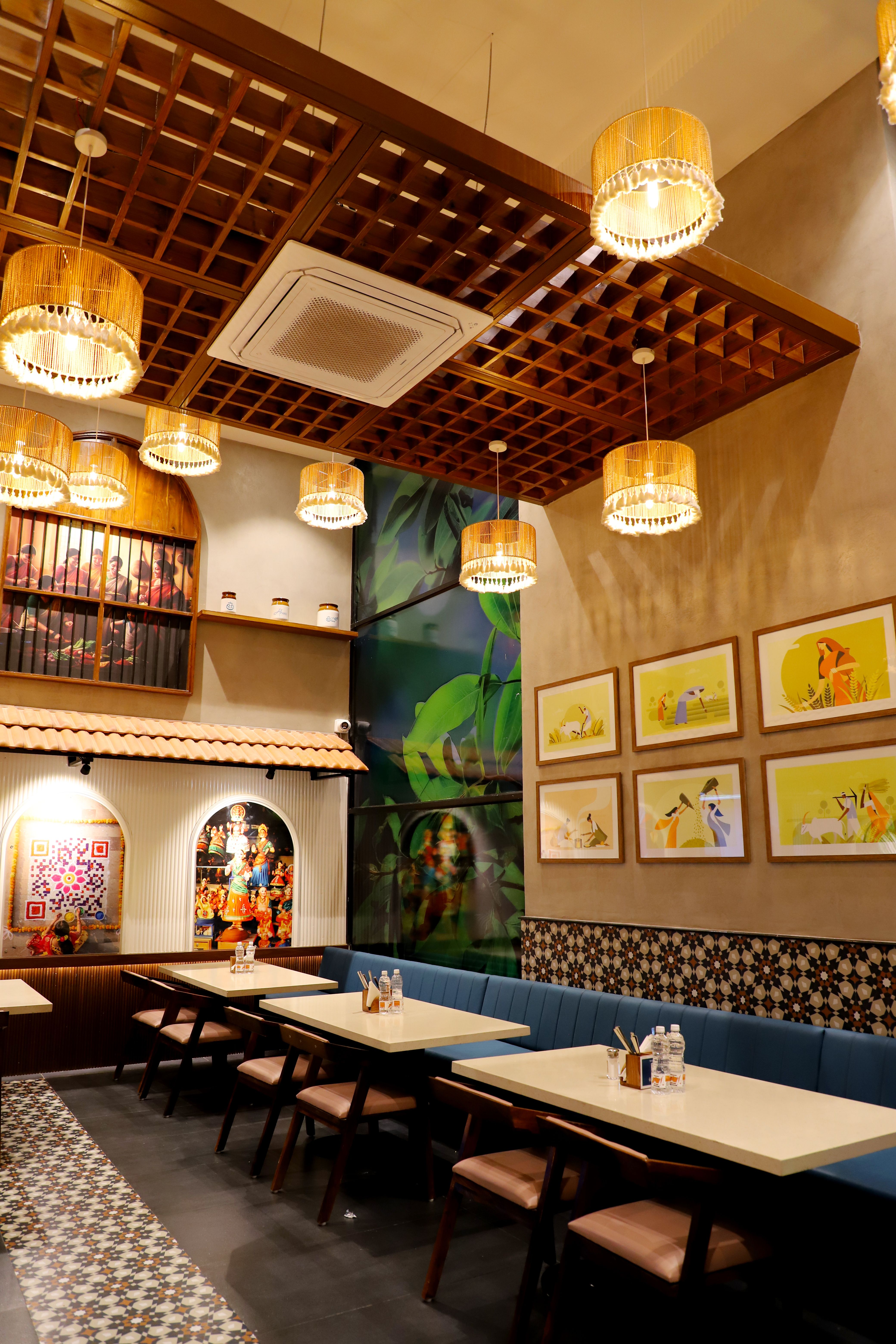 Warm and inviting restaurant interior with artistic decor and ambient lighting for a cozy dining experience.